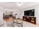 Open-concept living room with dining area and kitchen, perfect for modern living and entertaining guests at 4950 N Miller Rd # 200, Scottsdale, AZ 85251