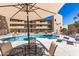 Relaxing community pool with lounge chairs and tables for enjoying the outdoors at 4950 N Miller Rd # 200, Scottsdale, AZ 85251