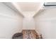 Walk-in closet with white wire shelving, rug, and wood floor at 4950 N Miller Rd # 200, Scottsdale, AZ 85251