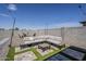 Backyard with comfortable outdoor seating, artificial turf, and a built-in patio at 5048 N 84Th Dr, Glendale, AZ 85305