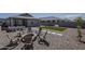 Backyard with fire pit and outdoor seating area, perfect for entertaining guests at 5048 N 84Th Dr, Glendale, AZ 85305