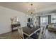 Inviting dining room featuring a stylish light fixture, table, and decor at 5048 N 84Th Dr, Glendale, AZ 85305