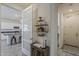 Welcoming entryway showcasing stylish decor, seamlessly connecting the kitchen and laundry area at 5048 N 84Th Dr, Glendale, AZ 85305