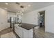 Bright kitchen island with modern pendant lights, stainless appliances, and a large single bowl apron sink at 5048 N 84Th Dr, Glendale, AZ 85305