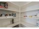 Walk-in pantry with shelving provides ample storage space at 5048 N 84Th Dr, Glendale, AZ 85305