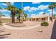 Large backyard showcases well-kept landscaping and mature palm trees at 530 N Jesse Ct, Chandler, AZ 85225