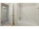 Neutral bathroom features a bathtub with shower at 530 N Jesse Ct, Chandler, AZ 85225