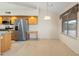 Eat-in kitchen area featuring stainless steel appliances, ample counter space, and a well-lit dining nook at 530 N Jesse Ct, Chandler, AZ 85225