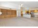 Bright open-concept living room flowing into the kitchen, with carpet flooring at 530 N Jesse Ct, Chandler, AZ 85225