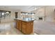 Inviting kitchen with island sink, seamlessly connected to the bright and airy living room with fireplace at 530 N Jesse Ct, Chandler, AZ 85225