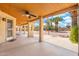 Under-covered patio featuring a ceiling fan and exterior access to the backyard at 530 N Jesse Ct, Chandler, AZ 85225
