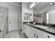 Stylish bathroom with double sinks, granite countertop, and decorative mirror at 5537 E Dusty Wren Dr, Cave Creek, AZ 85331