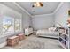 Light-filled bedroom featuring plantation shutters and neutral walls at 5537 E Dusty Wren Dr, Cave Creek, AZ 85331