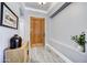 Stylish foyer featuring tile floors, a wood door, light gray walls and a decorative console table at 5537 E Dusty Wren Dr, Cave Creek, AZ 85331