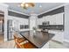 Beautiful kitchen featuring white cabinets, stainless steel appliances, and a dark granite island at 5537 E Dusty Wren Dr, Cave Creek, AZ 85331