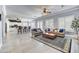 Spacious living room with tile floors, ceiling fans, neutral color palette, and open to the kitchen at 5537 E Dusty Wren Dr, Cave Creek, AZ 85331