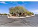 Wide street view showcasing the home's setting within the community with lush desert landscaping at 5537 E Dusty Wren Dr, Cave Creek, AZ 85331