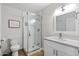 Updated bathroom with a glass enclosed shower, single sink, and modern fixtures at 6271 E Evans Dr, Scottsdale, AZ 85254