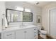 Bright bathroom with a large vanity, quartz counters and a glass enclosed shower at 6271 E Evans Dr, Scottsdale, AZ 85254