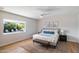 Cozy bedroom offers a serene retreat with pool view, king bed and stylish decor at 6271 E Evans Dr, Scottsdale, AZ 85254