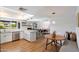 Modern kitchen with white countertops, stainless steel appliances, and a view into the dining area at 6271 E Evans Dr, Scottsdale, AZ 85254