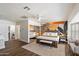 Spacious main bedroom boasts a king bed, accent wall, ensuite, and walk-in closet at 6271 E Evans Dr, Scottsdale, AZ 85254