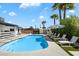 Beautiful pool area with lounge chairs, cabana, and lush landscaping at 6271 E Evans Dr, Scottsdale, AZ 85254