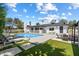 Expansive pool area with lounge seating, outdoor dining, and stylish exterior at 6271 E Evans Dr, Scottsdale, AZ 85254