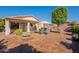 Large backyard with a patio, seating, a firepit, and desert landscaping at 6397 S Pinaleno Pl, Chandler, AZ 85249
