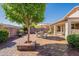 Spacious backyard patio features an outdoor seating area with a large tree providing shade, perfect for entertaining at 6397 S Pinaleno Pl, Chandler, AZ 85249