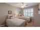 Inviting bedroom with twin beds, plantation shutters, and soft neutral tones for a relaxing ambiance at 6397 S Pinaleno Pl, Chandler, AZ 85249