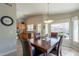 Cozy dining room with a kitchen in the background, bright and inviting at 6397 S Pinaleno Pl, Chandler, AZ 85249