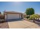 Charming single-story home with a well-maintained lawn, desert landscaping, and a two-car garage at 6397 S Pinaleno Pl, Chandler, AZ 85249