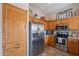 This beautiful kitchen features stainless steel appliances and light wood cabinets at 6397 S Pinaleno Pl, Chandler, AZ 85249