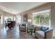 Bright and airy living area featuring neutral tones, a large window, and comfortable seating at 6397 S Pinaleno Pl, Chandler, AZ 85249