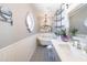 Charming bathroom featuring a clawfoot tub, decorative tile, and modern fixtures at 6526 N 13Th Dr, Phoenix, AZ 85013