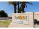Welcoming community entrance sign with lush landscaping and desert-style architecture, setting a peaceful tone at 6526 N 13Th Dr, Phoenix, AZ 85013