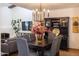 Dining area featuring hardwood floors and views to the fireplace and living room at 6526 N 13Th Dr, Phoenix, AZ 85013