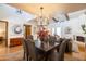 Open-concept living space featuring dining area with vaulted ceilings and hardwood floors at 6526 N 13Th Dr, Phoenix, AZ 85013