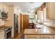 Charming kitchen with custom cabinets, modern appliances, and wood floors at 6526 N 13Th Dr, Phoenix, AZ 85013