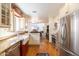 Well-equipped kitchen with stainless steel appliances, granite countertops, and custom cabinets at 6526 N 13Th Dr, Phoenix, AZ 85013