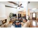 Open-concept living room boasts high ceilings, fireplace, and access to the dining area at 6526 N 13Th Dr, Phoenix, AZ 85013