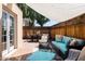 Cozy outdoor patio with comfortable seating, dining area, and stylish decor at 6526 N 13Th Dr, Phoenix, AZ 85013