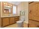 Well-maintained bathroom features a vanity with ample storage and toilet at 701 S Dobson Rd # 259, Mesa, AZ 85202