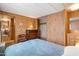 Inviting bedroom features wood paneling and built in closet at 701 S Dobson Rd # 259, Mesa, AZ 85202