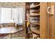 Corner nook area with built-in shelving, a desk, and a vintage telephone on the wall at 701 S Dobson Rd # 259, Mesa, AZ 85202