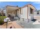 Charming mobile home featuring a covered porch with seating and neat landscaping at 701 S Dobson Rd # 259, Mesa, AZ 85202