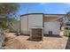 Exterior view of a shed, manufactured home, and air conditioner unit on a sunny day at 701 S Dobson Rd # 259, Mesa, AZ 85202