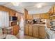 Traditional kitchen features wood cabinets, laminate countertop and opens to the living area at 701 S Dobson Rd # 259, Mesa, AZ 85202
