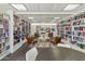 Bright and inviting library space with bookshelves, chairs, and tables, creating a quiet spot for reading and study at 701 S Dobson Rd # 259, Mesa, AZ 85202